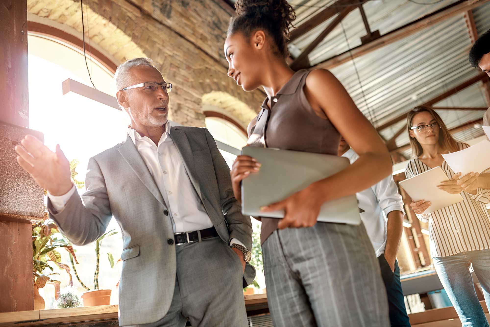 business-professionals-two-colleagues-discussing-2022-resized Creating High Performing Leaders